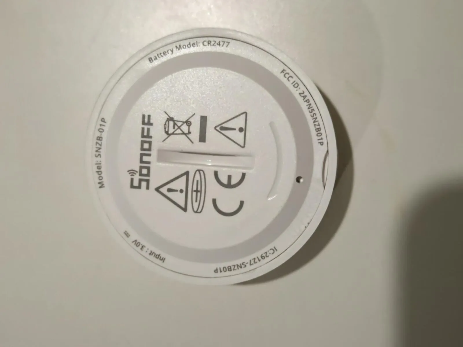 The back of the Sonoff button: model SNZB-01P, battery model CR2477, input 3.0 V